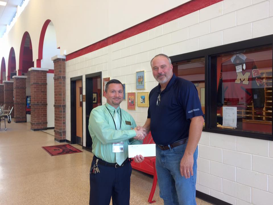 McIntosh County Academy Presented Check From Lewis & Raulerson, Inc. and Exxon